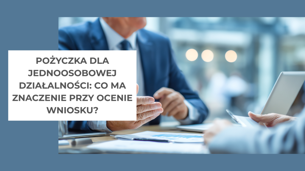 dwie osoby w garniturach siedzą przy stole